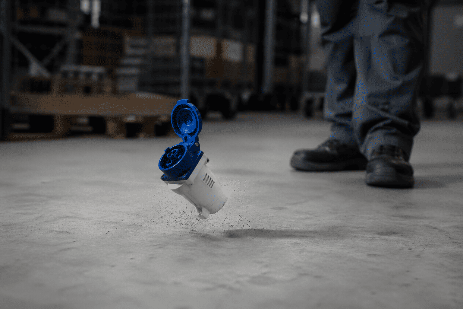 A socket being dropped on the floor to test its durability